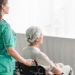 side-view-nurse-pushing-disabled-patient-wheel-chair